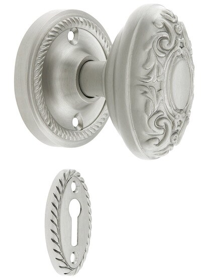 Rope Rosette Mortise Lock Set With Decorative Oval Knobs in Satin Nickel finish.